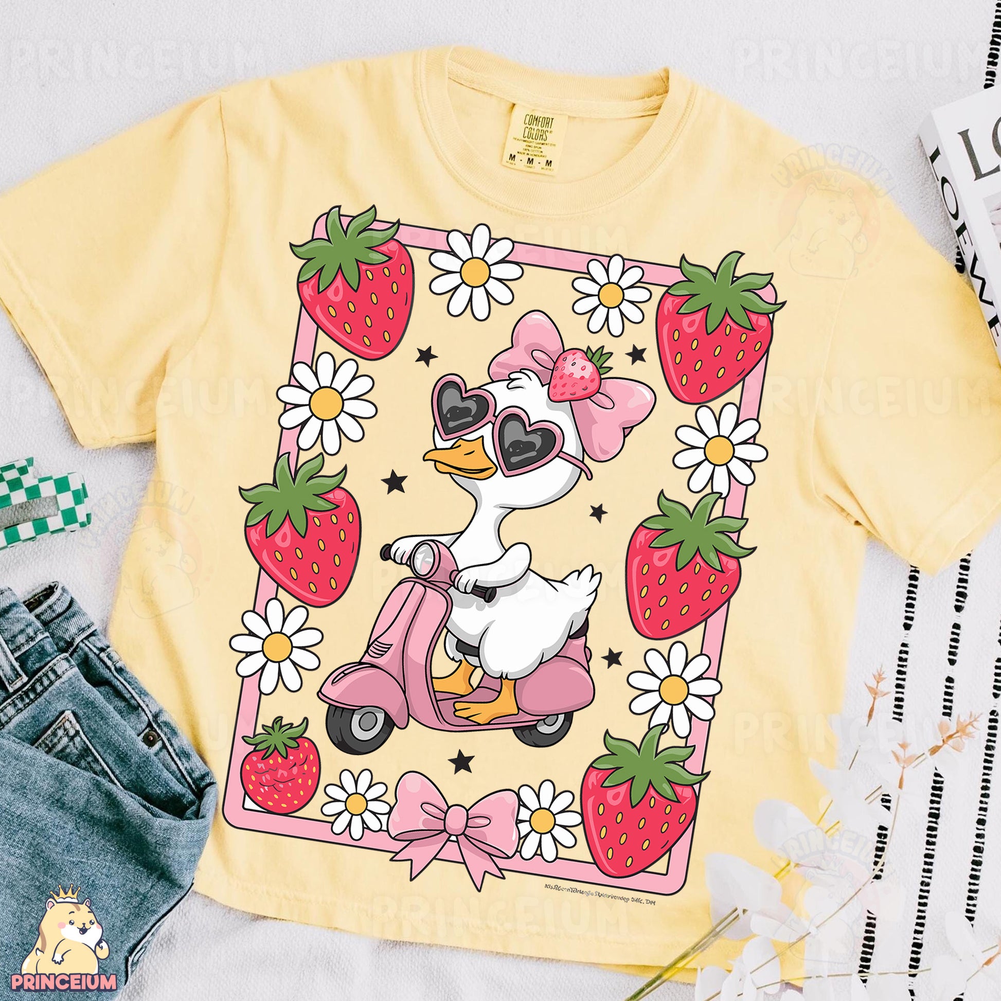 a yellow shirt with a duck riding a scooter