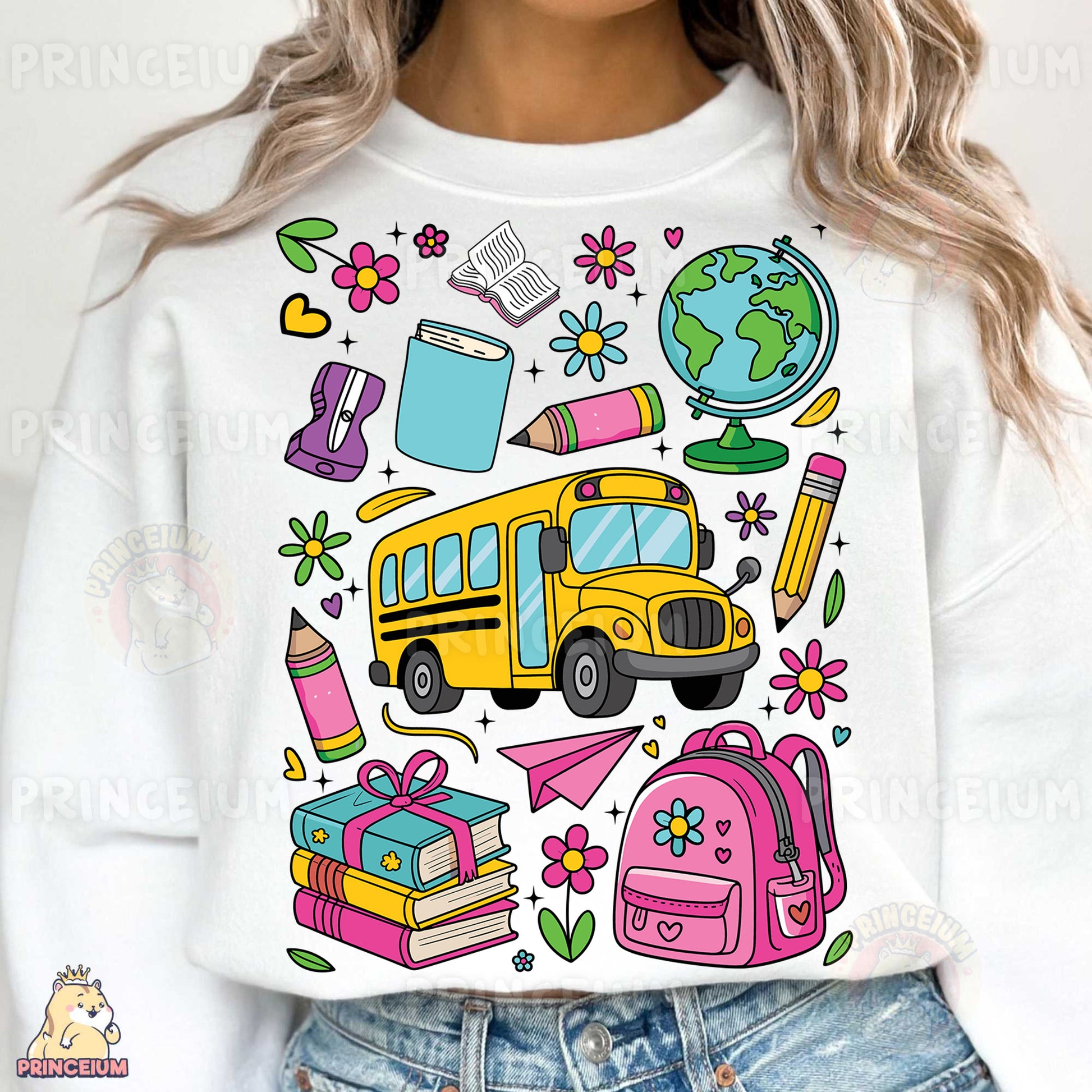 a woman wearing a white sweatshirt with school supplies on it
