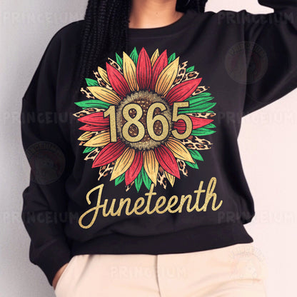 a woman wearing a black sweatshirt with a sunflower on it