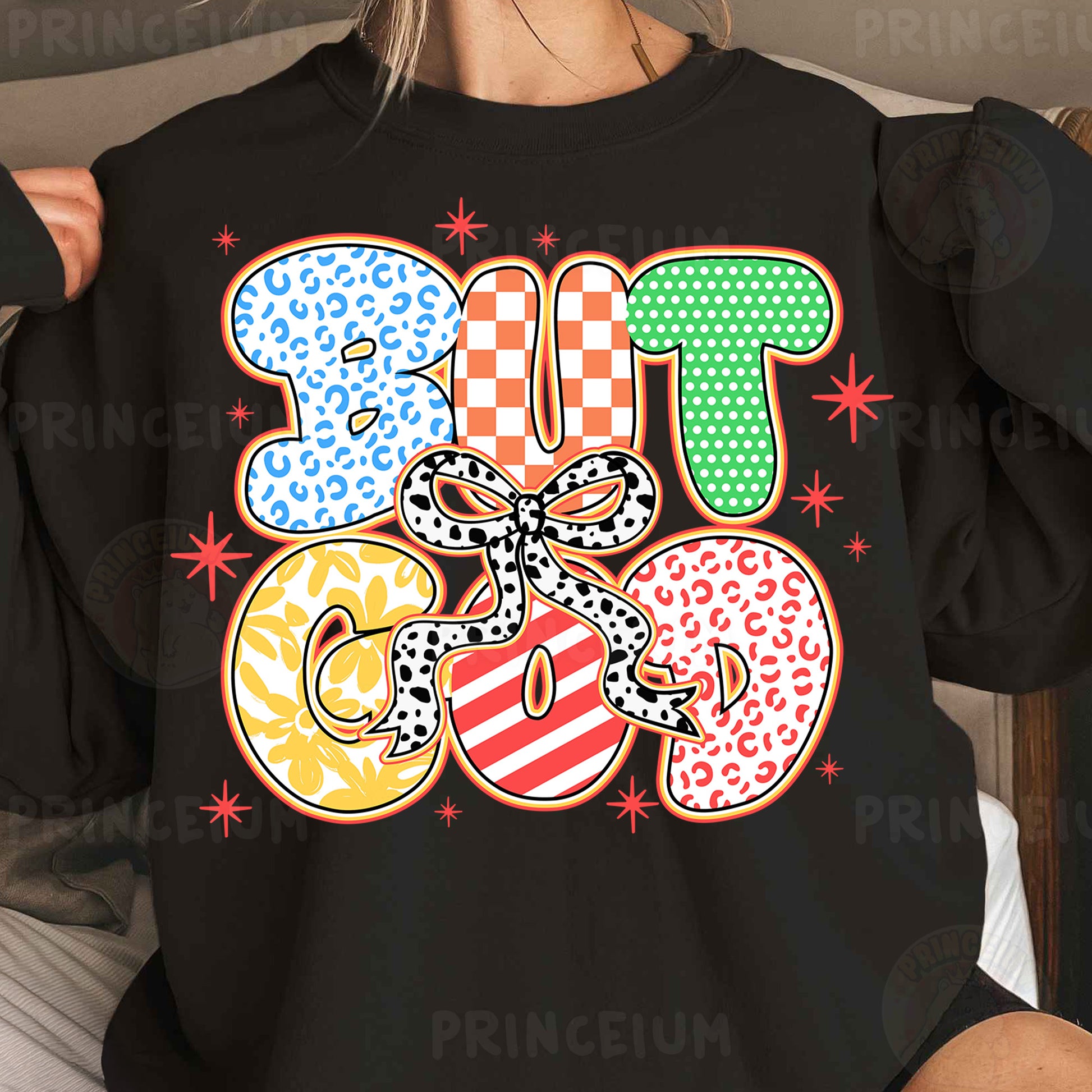 a woman wearing a black tshirt with colorful letters