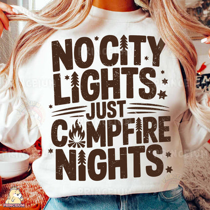 a woman wearing a white shirt that says nocty lights just campfire nights