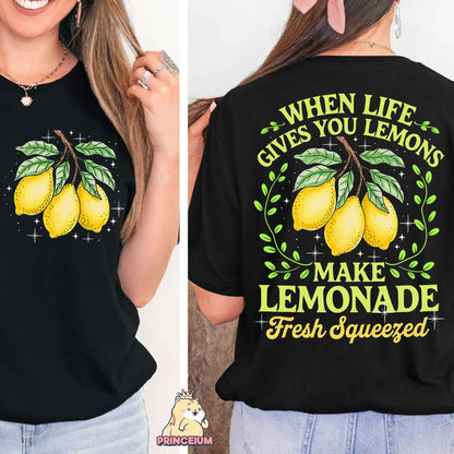 a woman wearing a t - shirt that says when life gives you lemons make