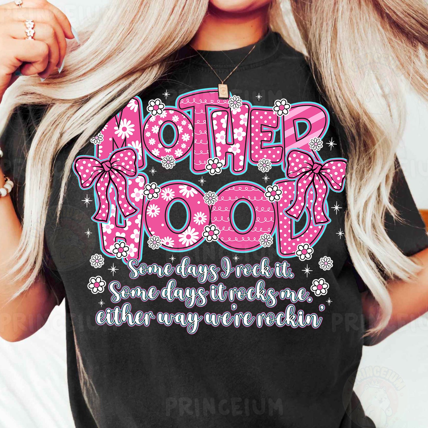 a woman wearing a t - shirt that says motherhood