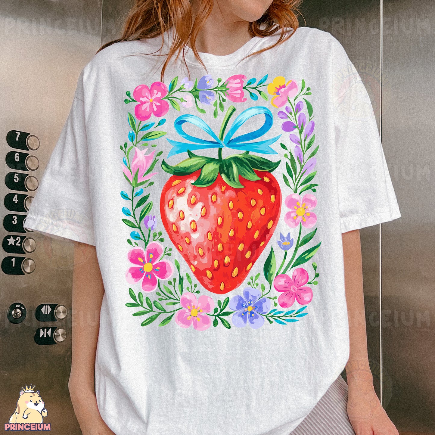 a woman wearing a white shirt with a strawberry on it