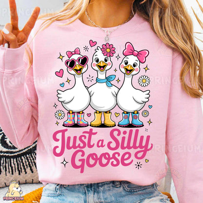 a woman wearing a pink shirt that says just a silly goose