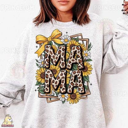 a woman wearing a sweatshirt that says mama with sunflowers