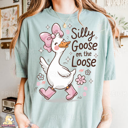 a girl wearing a silly goose on the loose shirt