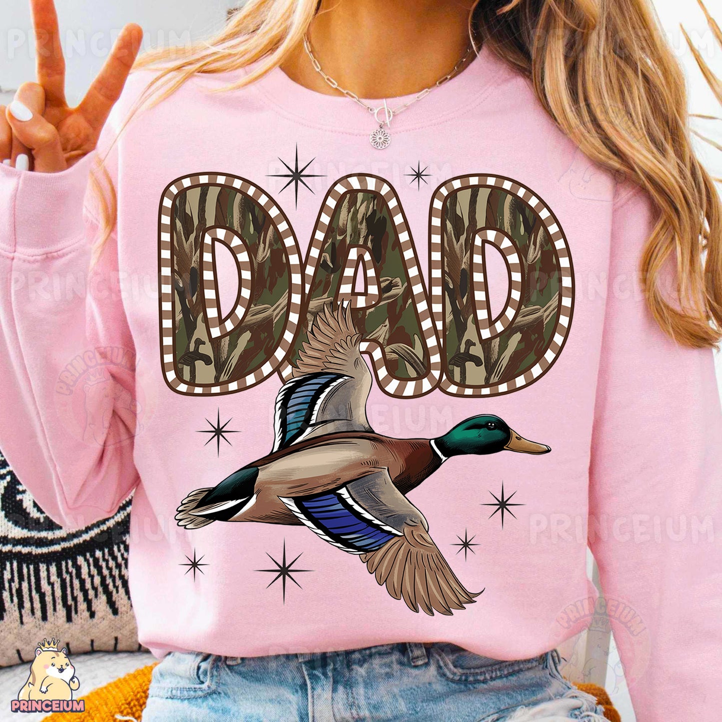 a woman wearing a pink shirt with a duck on it