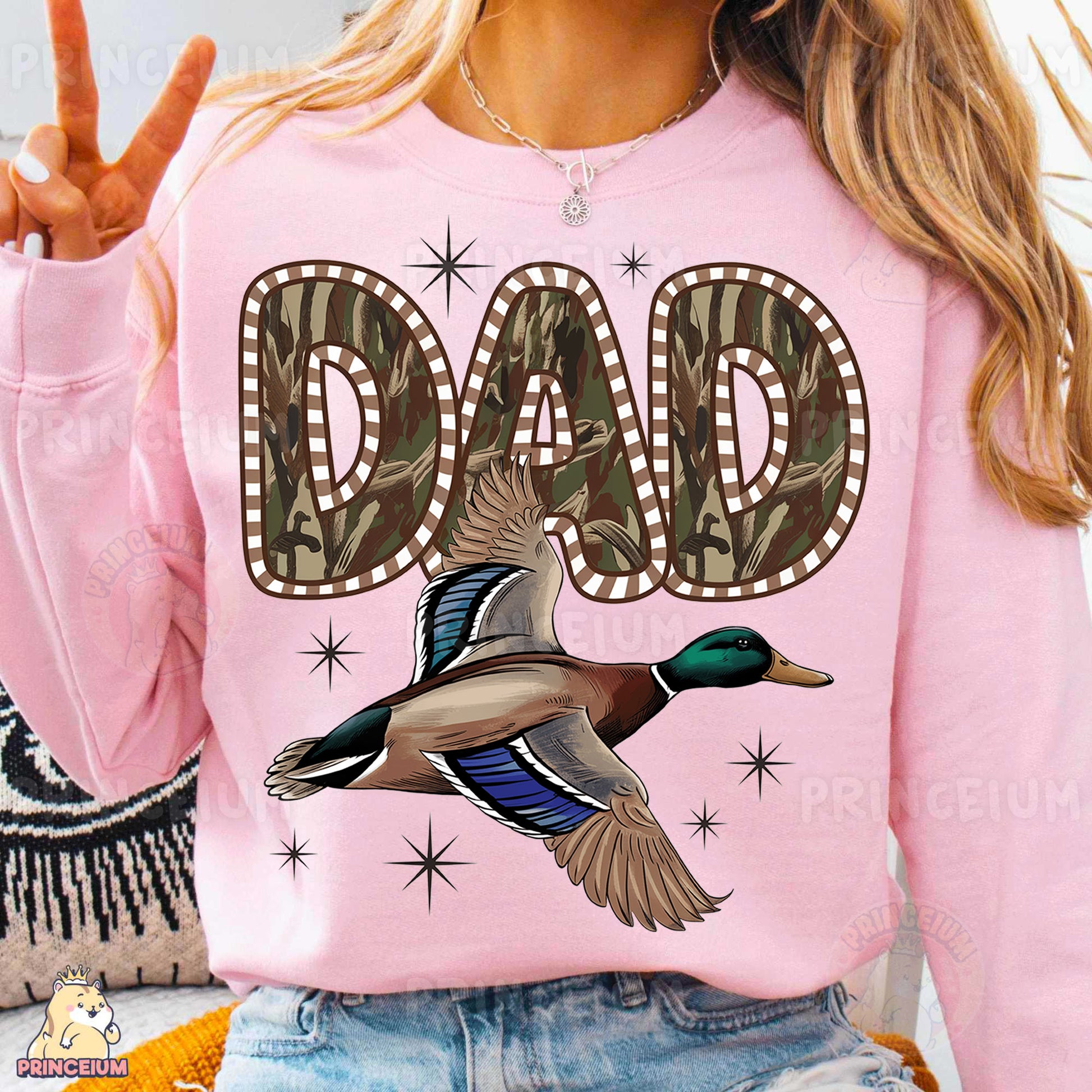 a woman wearing a pink shirt with a duck on it