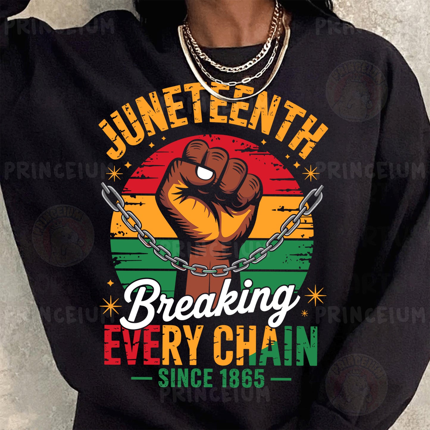a woman wearing a black sweatshirt with a fist on it