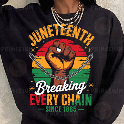a woman wearing a black sweatshirt with a fist on it