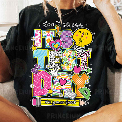 a woman sitting on a couch wearing a black t - shirt