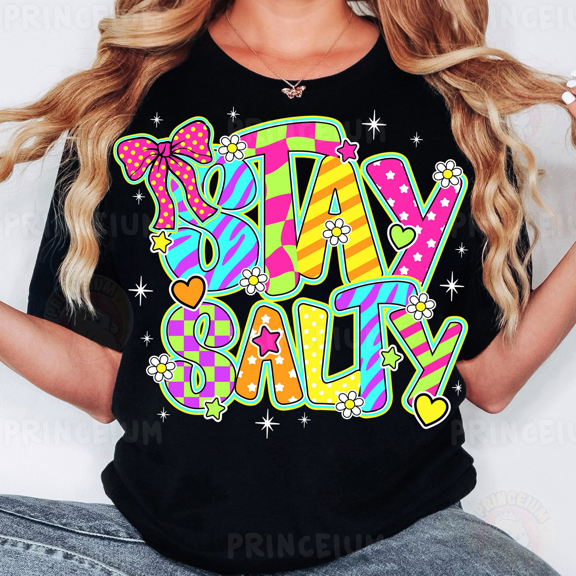 a woman wearing a black shirt that says stay salty