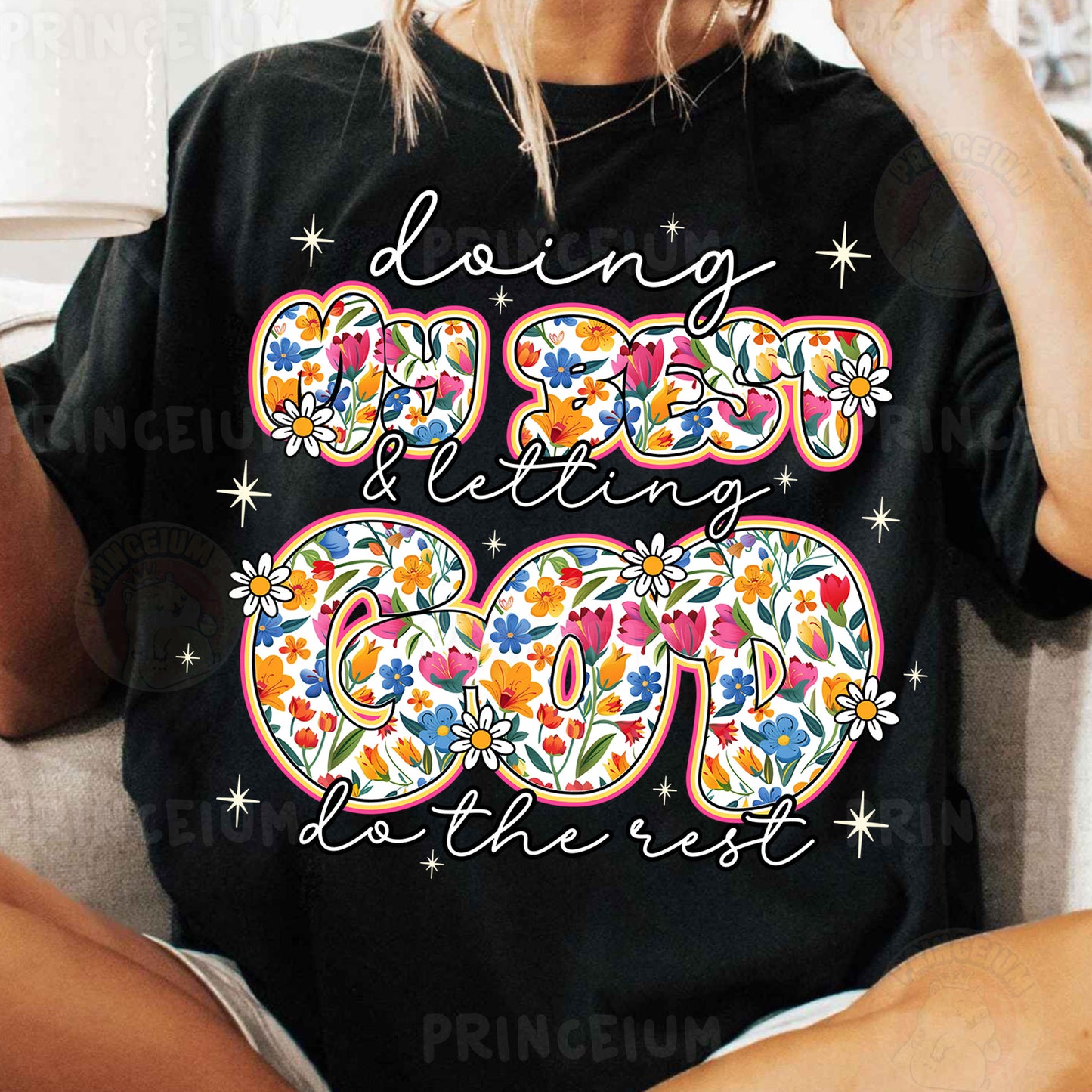 a woman sitting on a couch wearing a black shirt