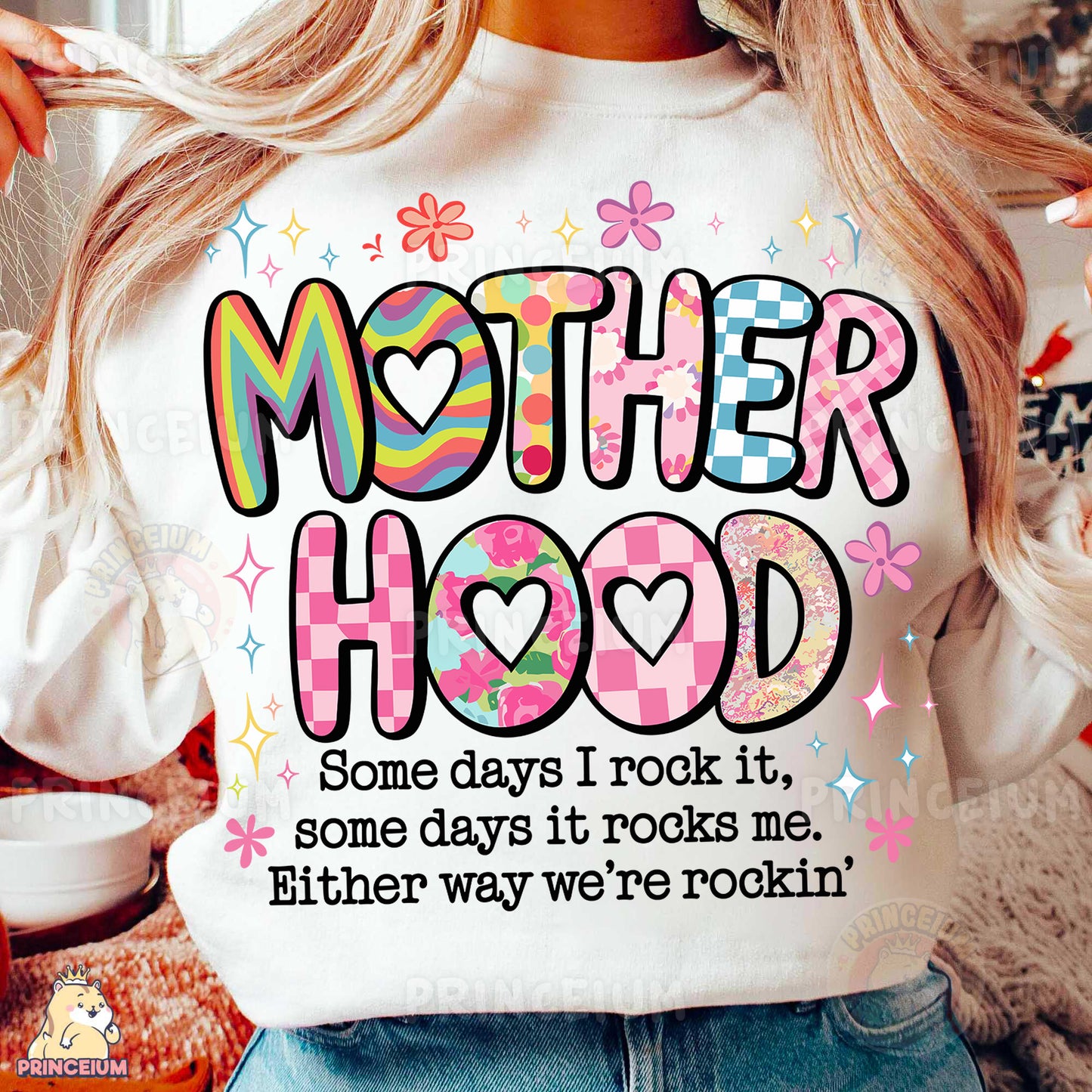 a woman wearing a t - shirt that says motherhood