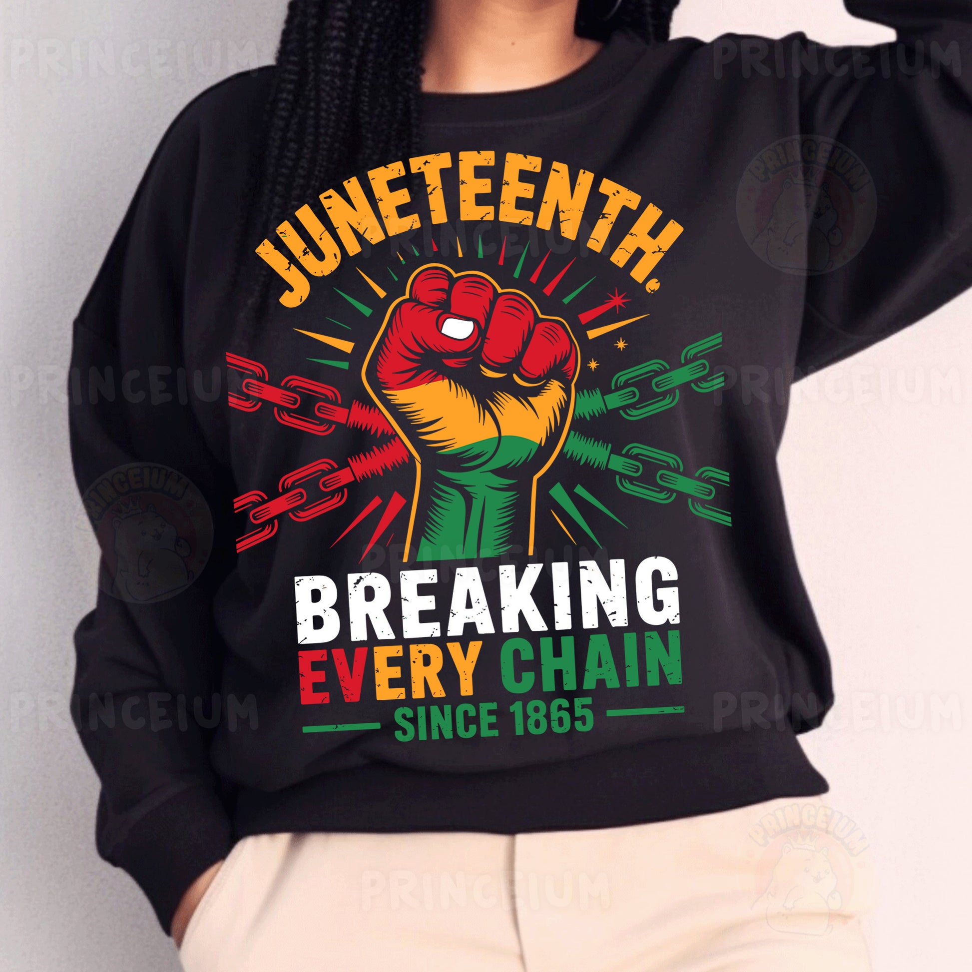 a woman wearing a black sweatshirt with a fist on it