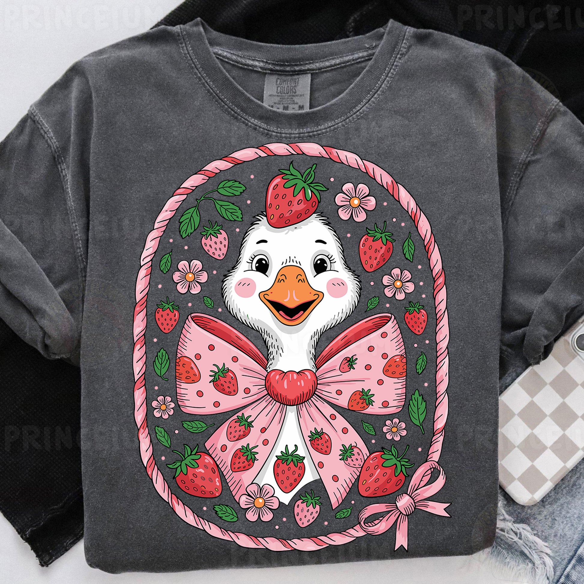 a t - shirt with a duck wearing a bow and strawberries