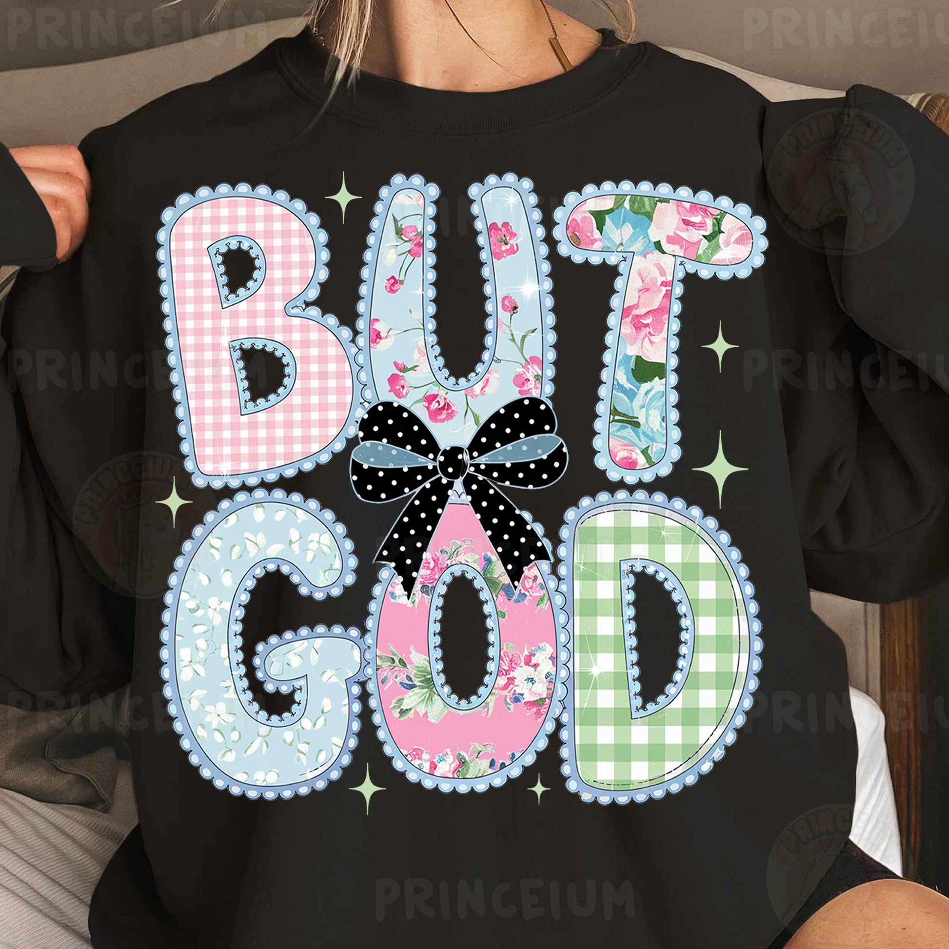 a woman wearing a black shirt that says but god