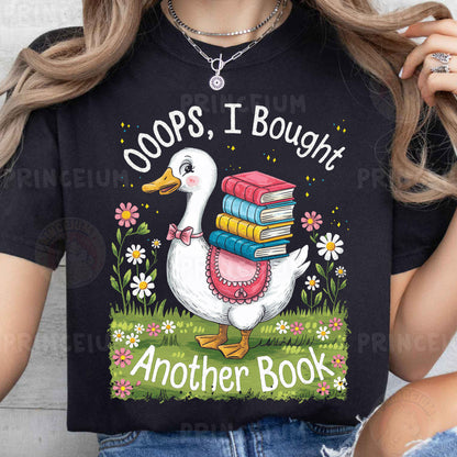 a woman wearing a t - shirt with a goose holding a stack of books