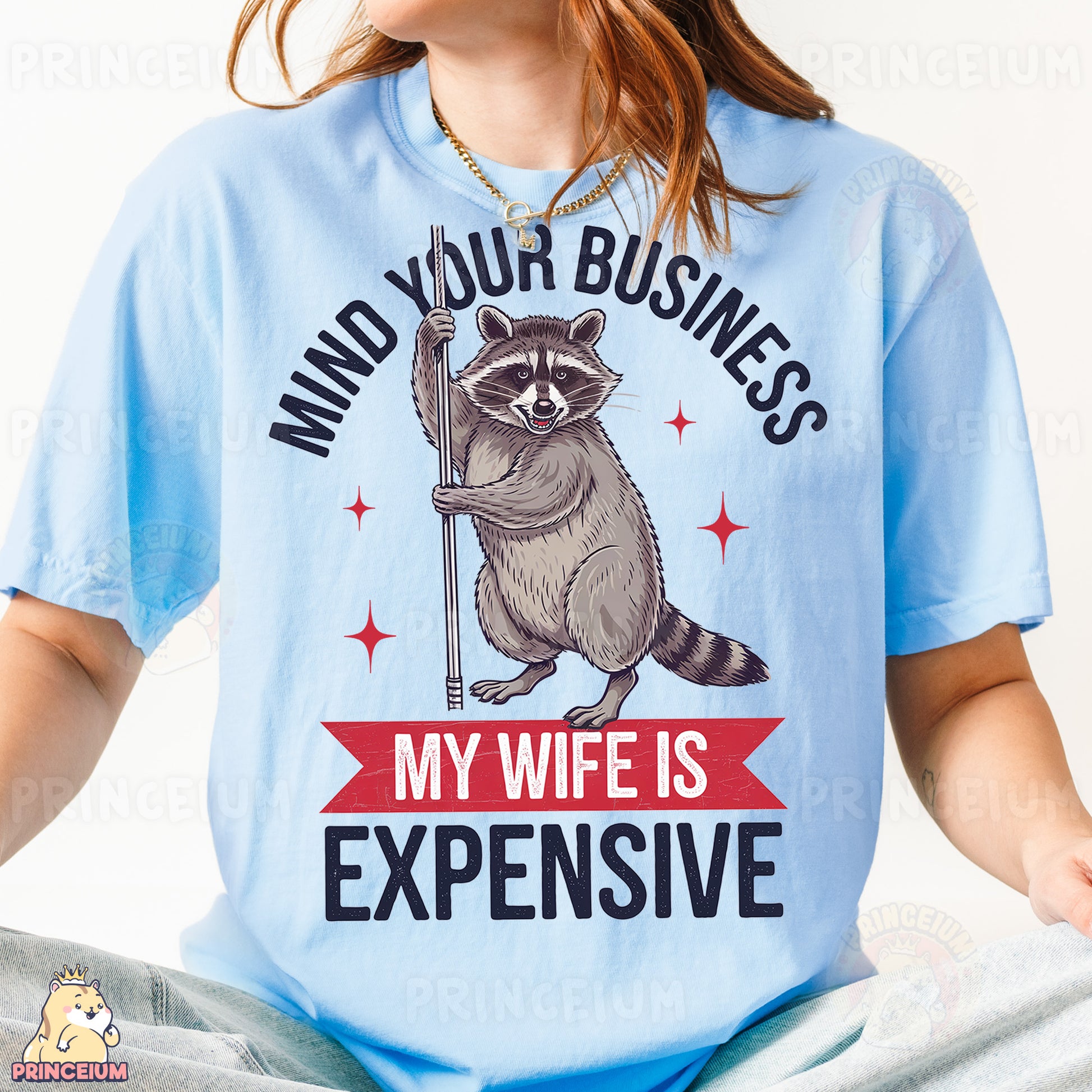 a woman wearing a blue shirt with a raccoon on it