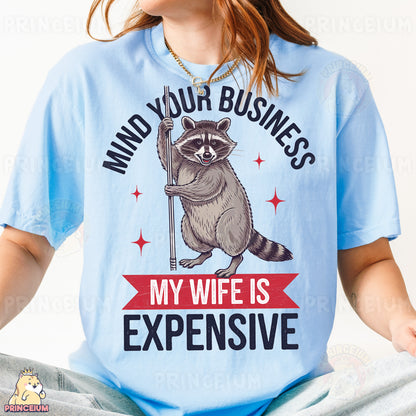 a woman wearing a blue shirt with a raccoon on it