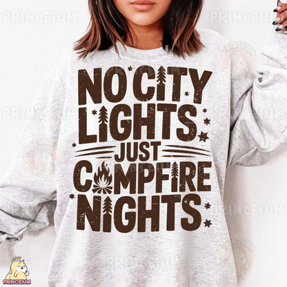 a woman wearing a sweatshirt that says no city lights just campfire nights