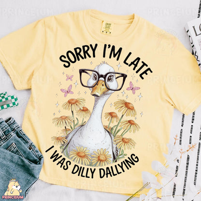 a yellow shirt with a picture of a duck wearing glasses
