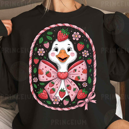 a woman wearing a black shirt with a picture of a duck wearing a pink bow