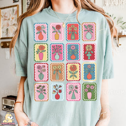 a woman wearing a t - shirt with a bunch of flowers on it