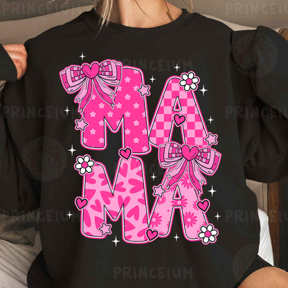 a woman wearing a black shirt with pink letters and bows
