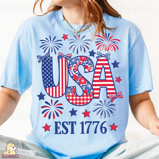 a woman wearing a usa t - shirt with fireworks
