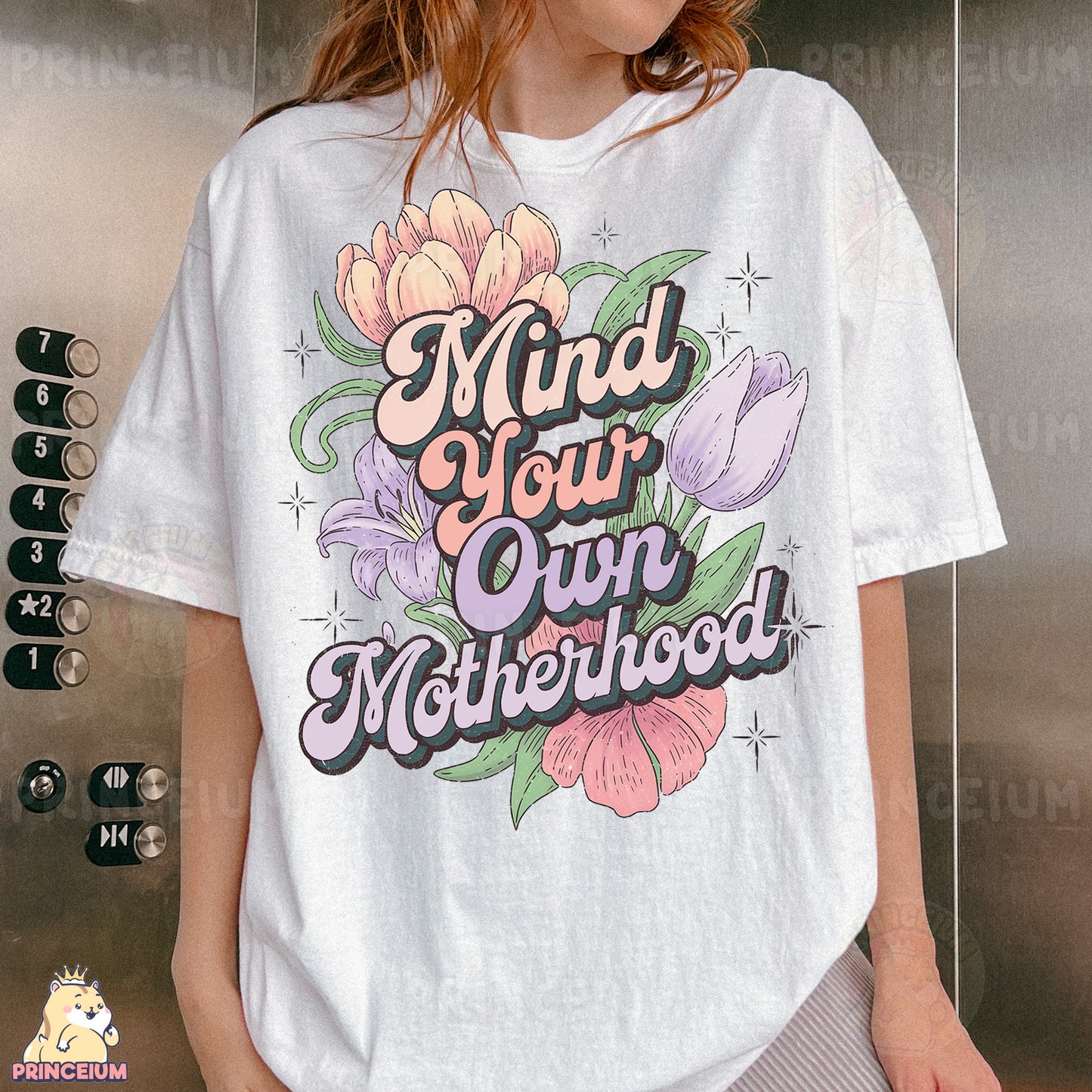 a woman wearing a t - shirt that says mind your own motherhood