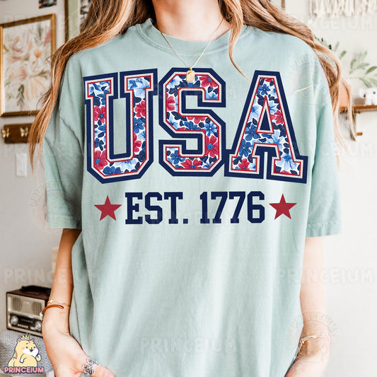 a woman wearing a usa t - shirt in front of a wall