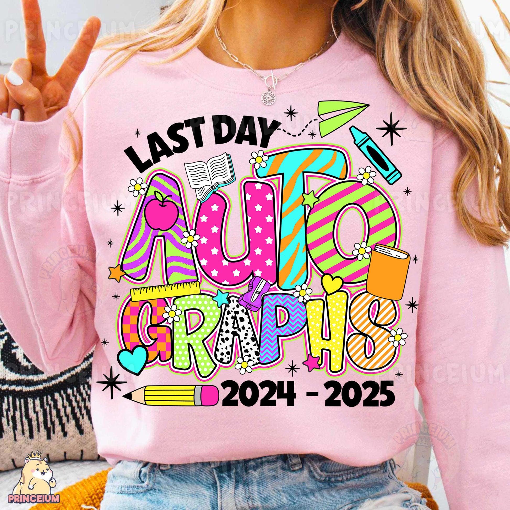 a woman wearing a pink shirt that says last day auto graphics