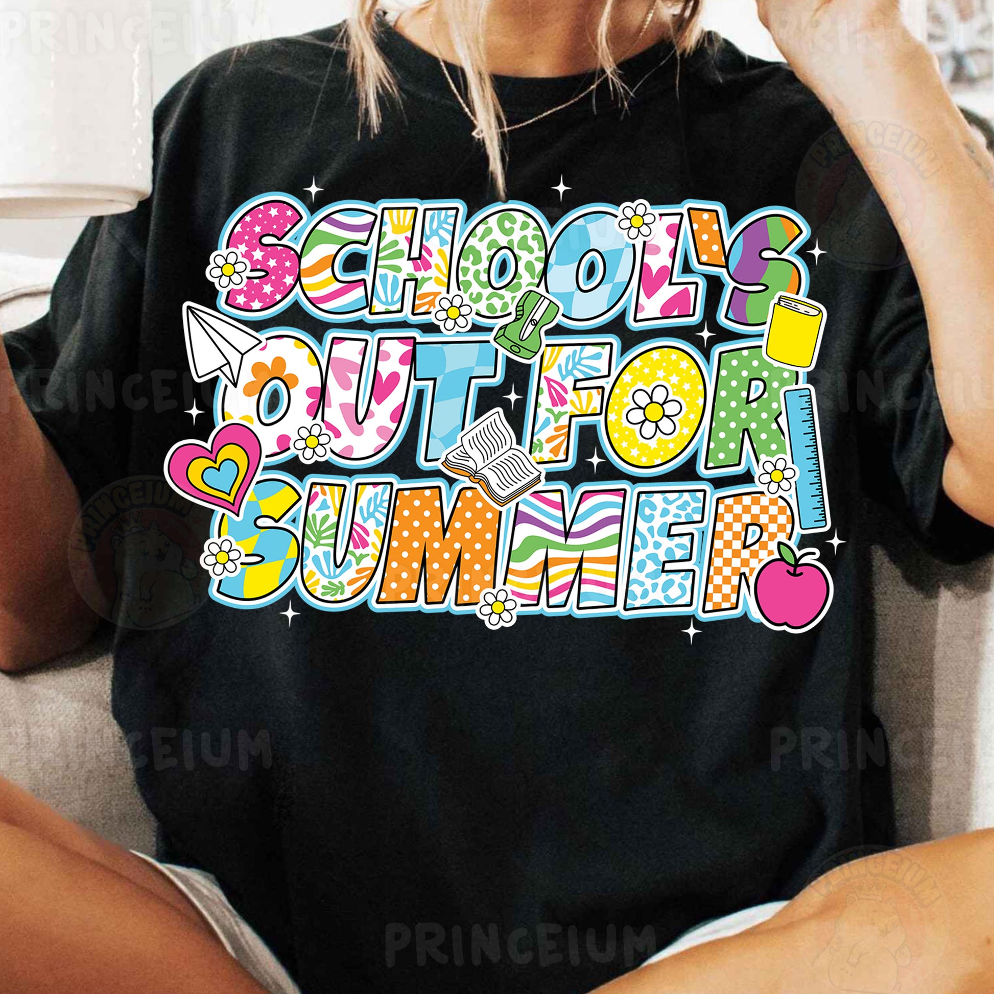 a woman sitting on a couch wearing a black shirt that says school out for summer