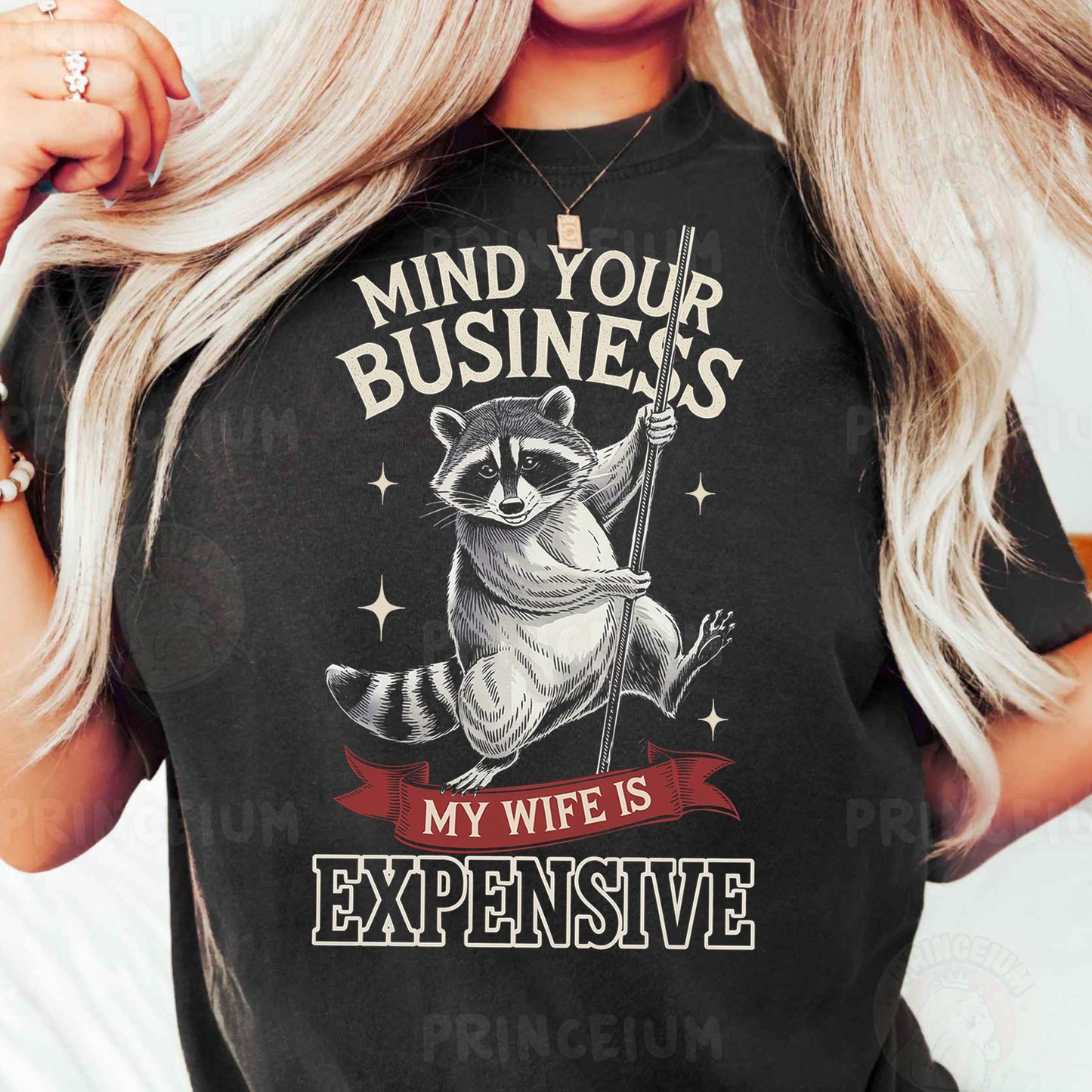 a woman wearing a black shirt with a raccoon on it