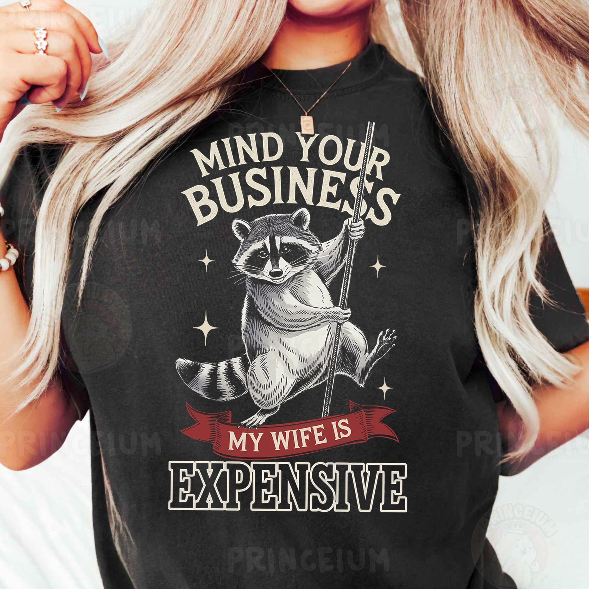 a woman wearing a black shirt with a raccoon on it