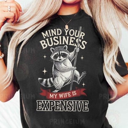 a woman wearing a black shirt with a raccoon on it
