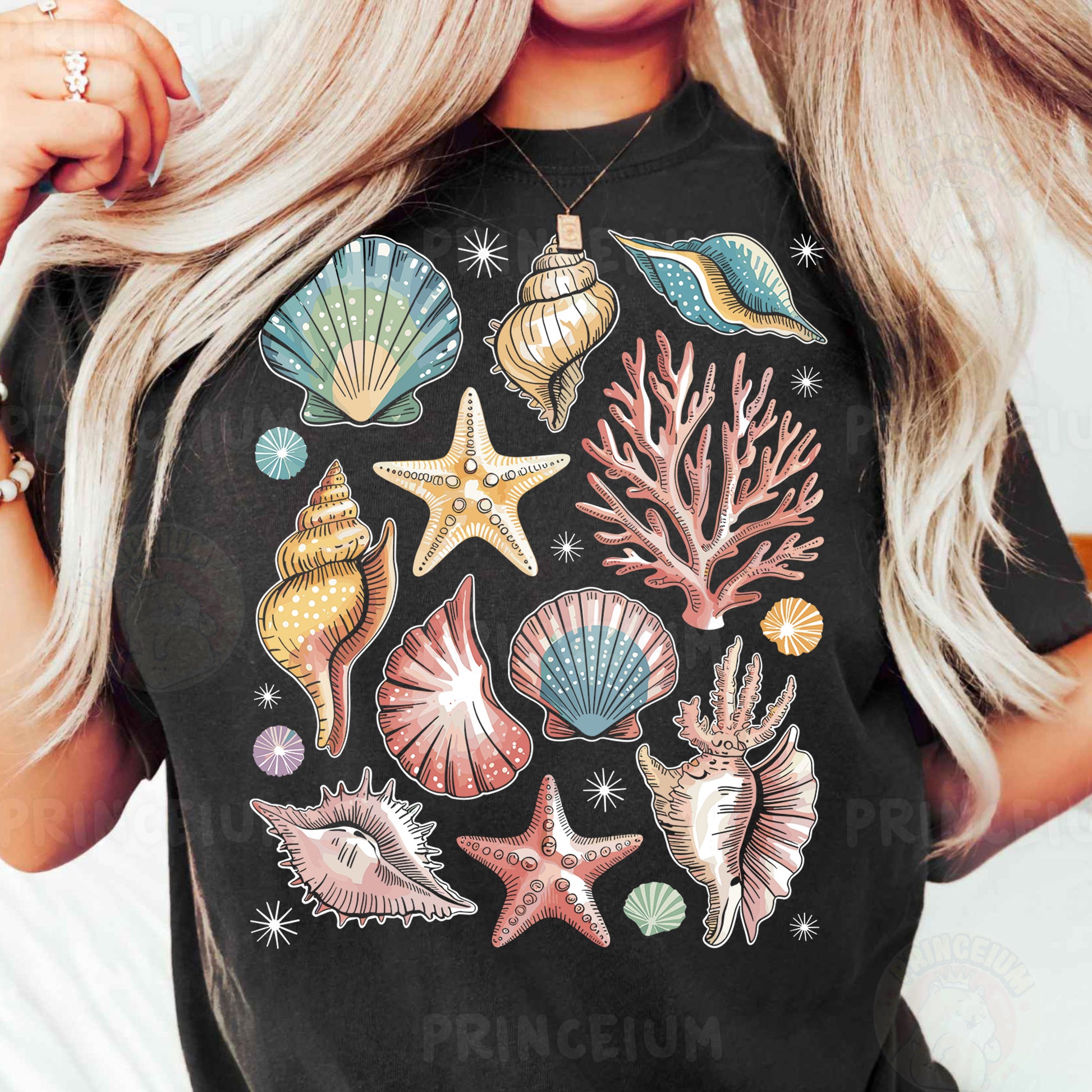 a woman wearing a black t - shirt with colorful seashells and starfish