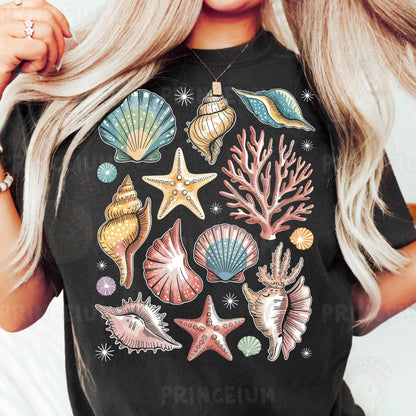 a woman wearing a black t - shirt with colorful seashells and starfish