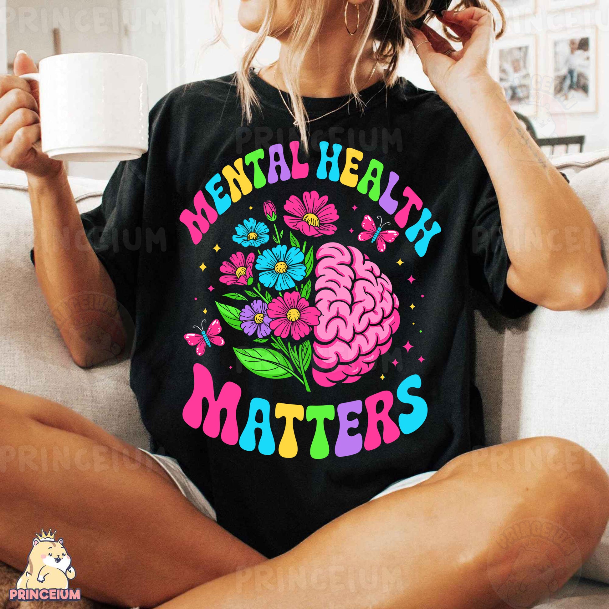 a woman sitting on a couch holding a cup of coffee