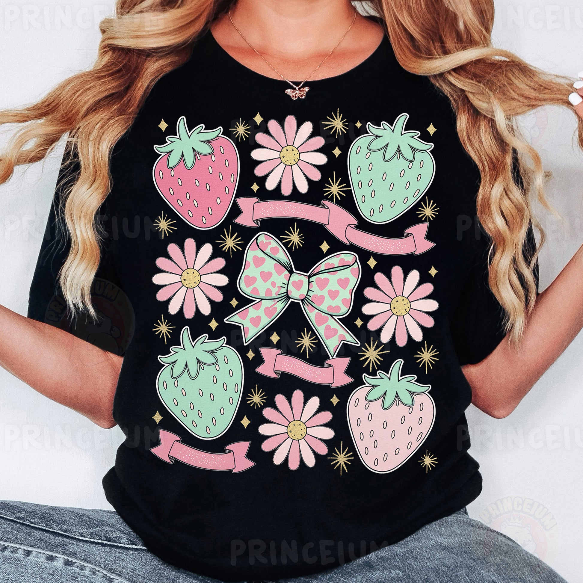 a woman wearing a black tshirt with a bow and strawberries on it