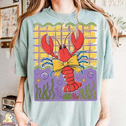 a woman wearing a t - shirt with a lobster on it