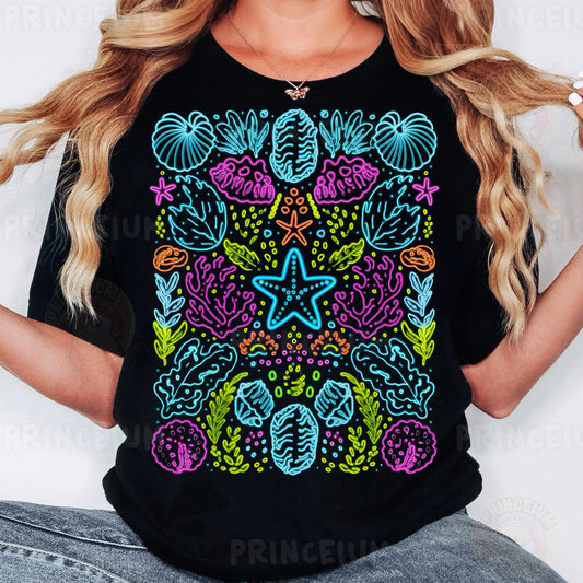 a woman wearing a black t - shirt with a colorful design on it