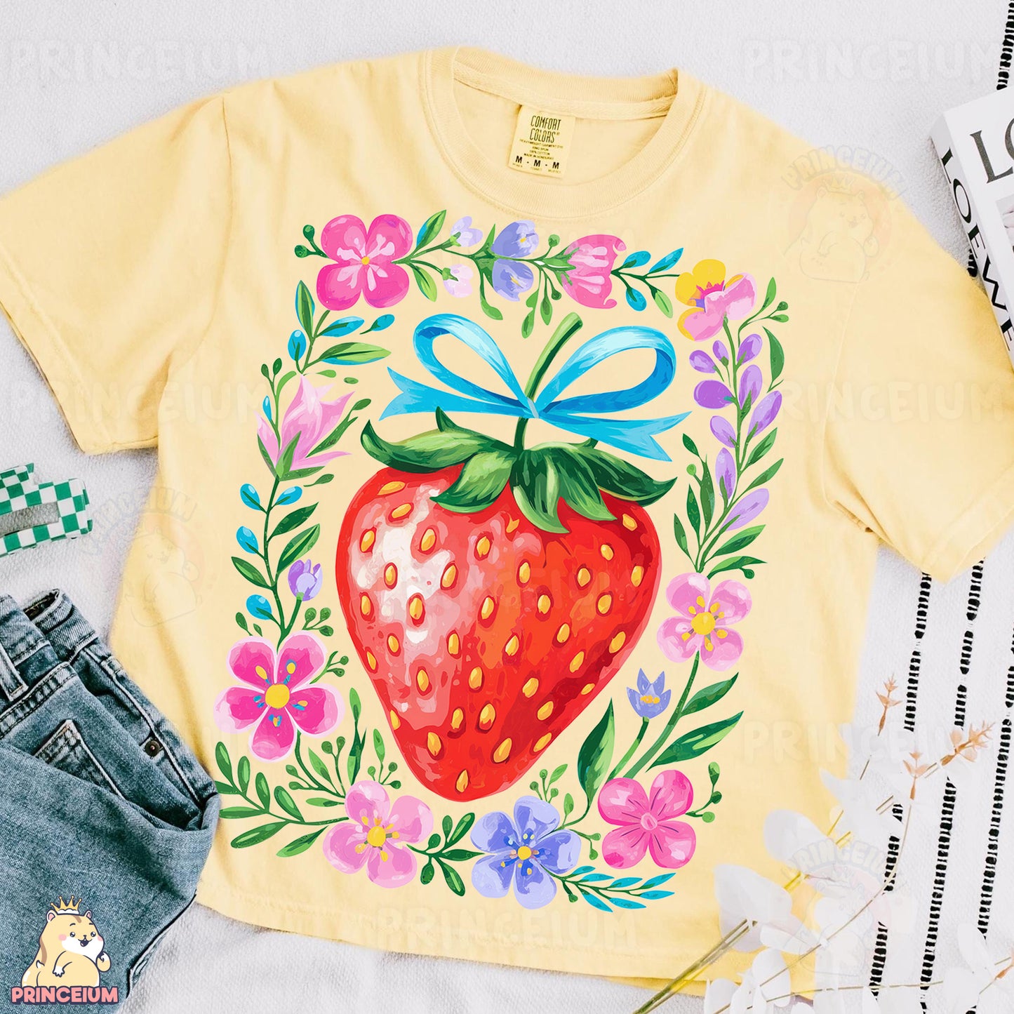 a yellow shirt with a picture of a strawberry on it