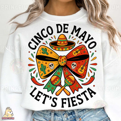 a woman wearing a cinco de mayo let's fiesta sweatshirt