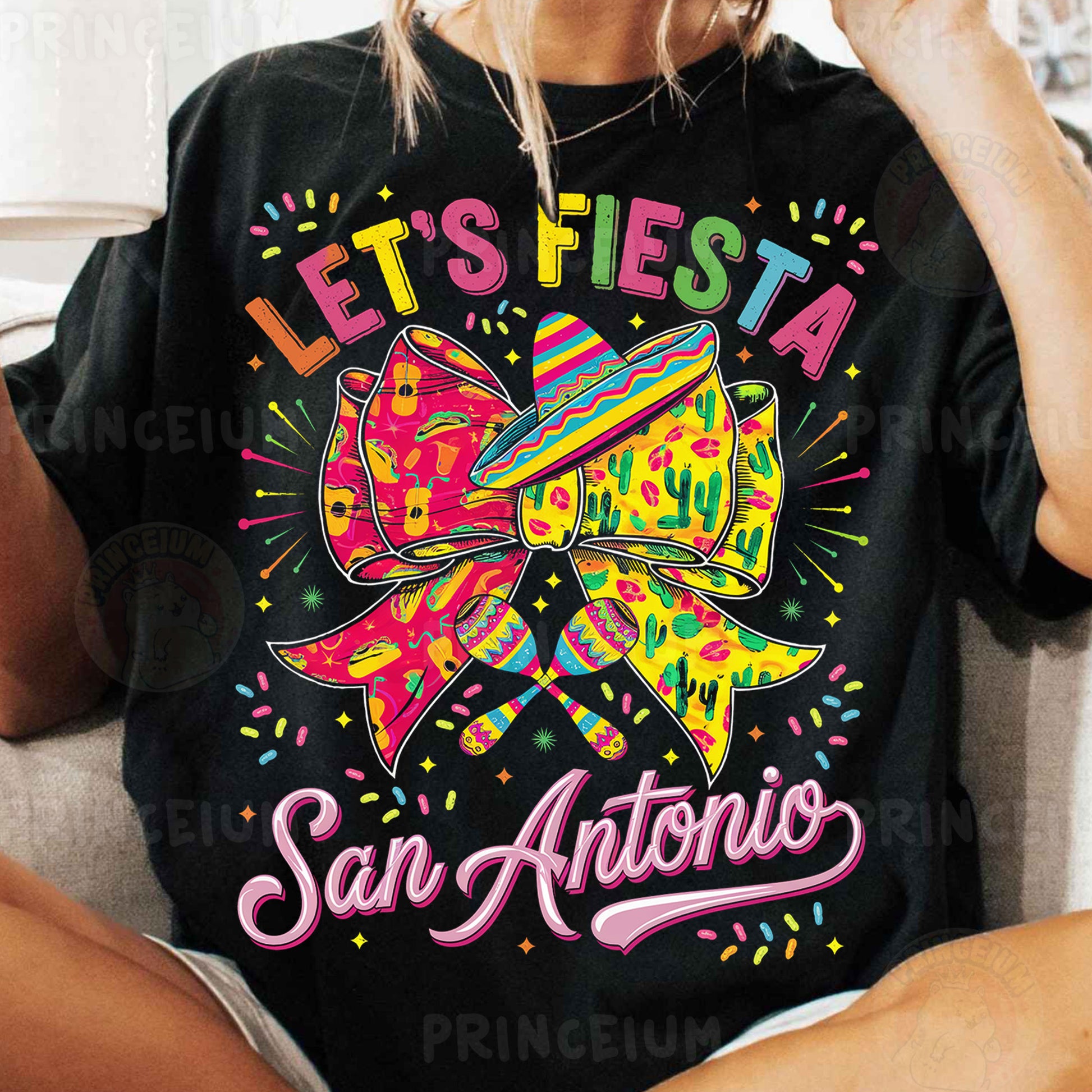 a woman sitting on a couch wearing a black shirt