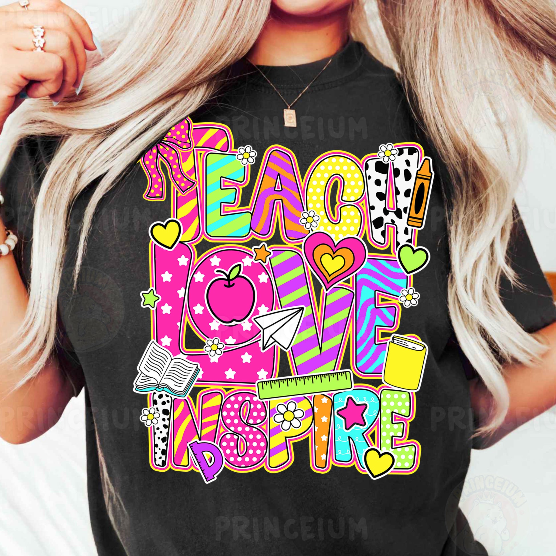 a woman wearing a t - shirt that says teach love inspire