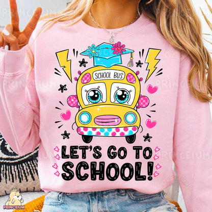a woman wearing a pink shirt with a school bus on it
