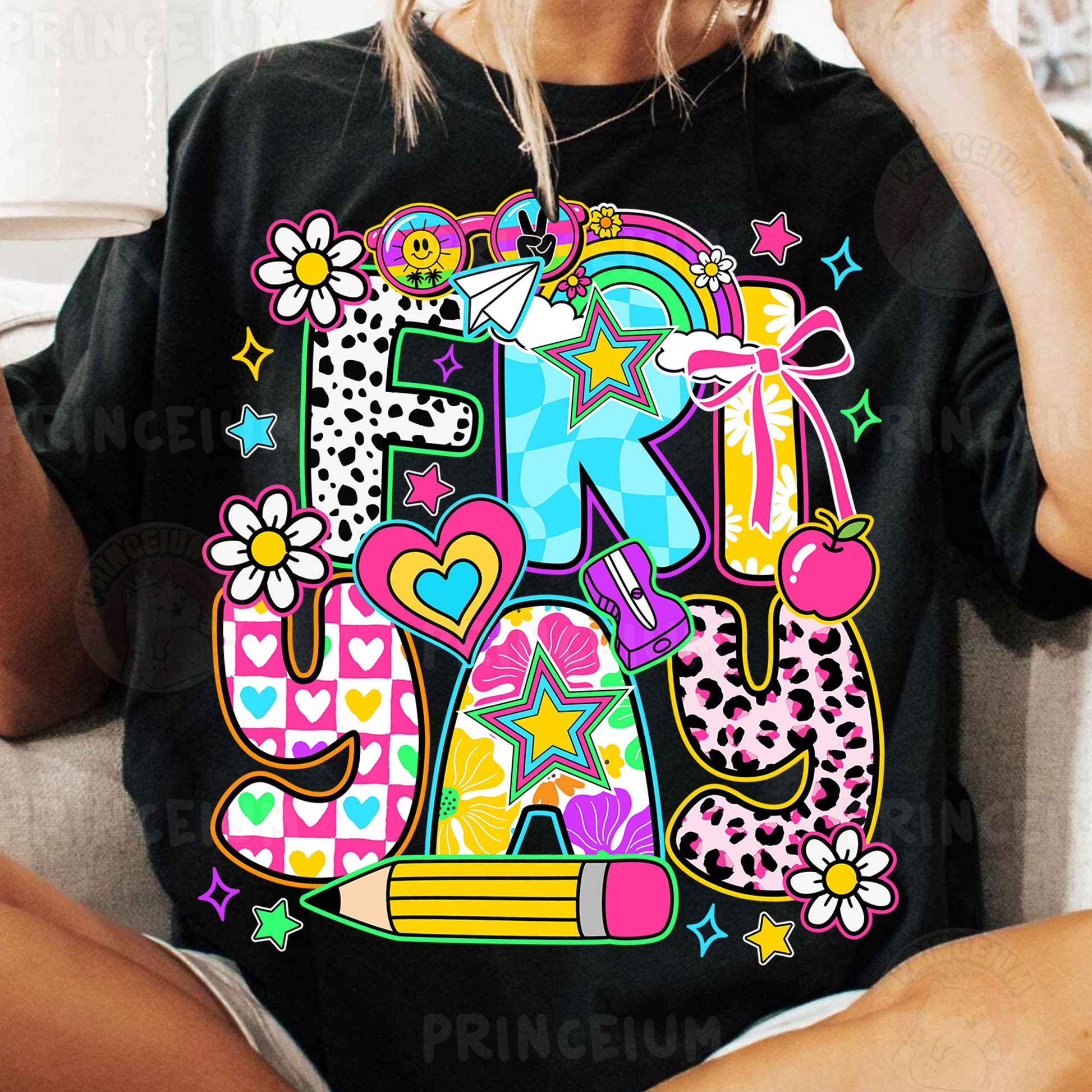 a woman sitting on a couch wearing a black t - shirt with the letter e